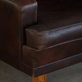 Pair of modern Danish lounge chairs in dark brown leather and rosewood, 1960s.