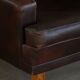 Pair of modern Danish lounge chairs in dark brown leather and rosewood, 1960s.