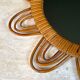 Rattan mirror representing a sun