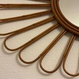 Old vintage asymmetrical round rattan mirror