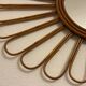 Old vintage asymmetrical round rattan mirror