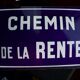 Old Enamelled and bulging "Chemin de la Rente" street plate, in perfect condition, on its cast iron support