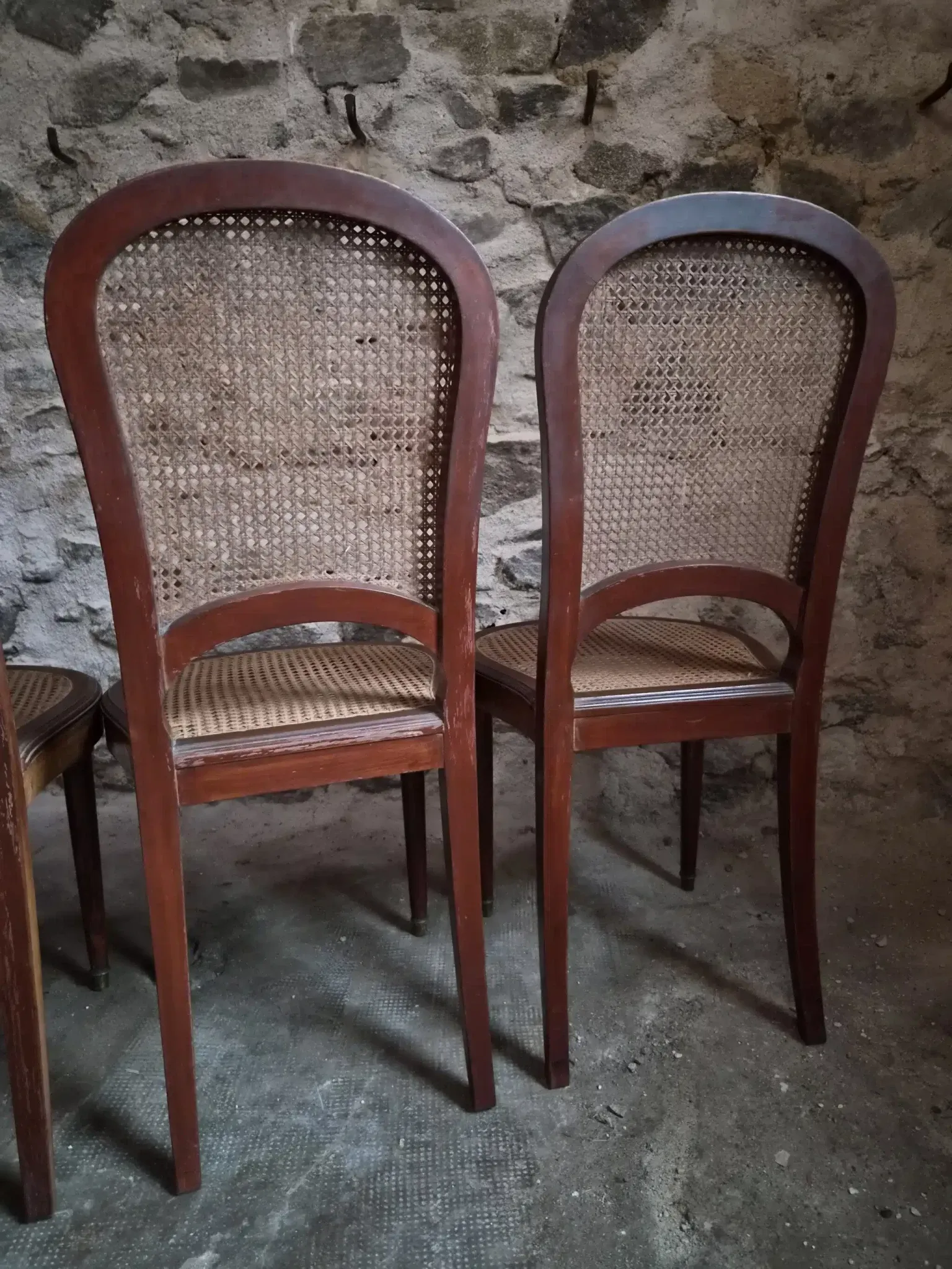Set of 6 antique Louis XVI style dining chairs with caning.