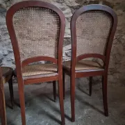 Set of 6 antique Louis XVI style dining chairs with caning.