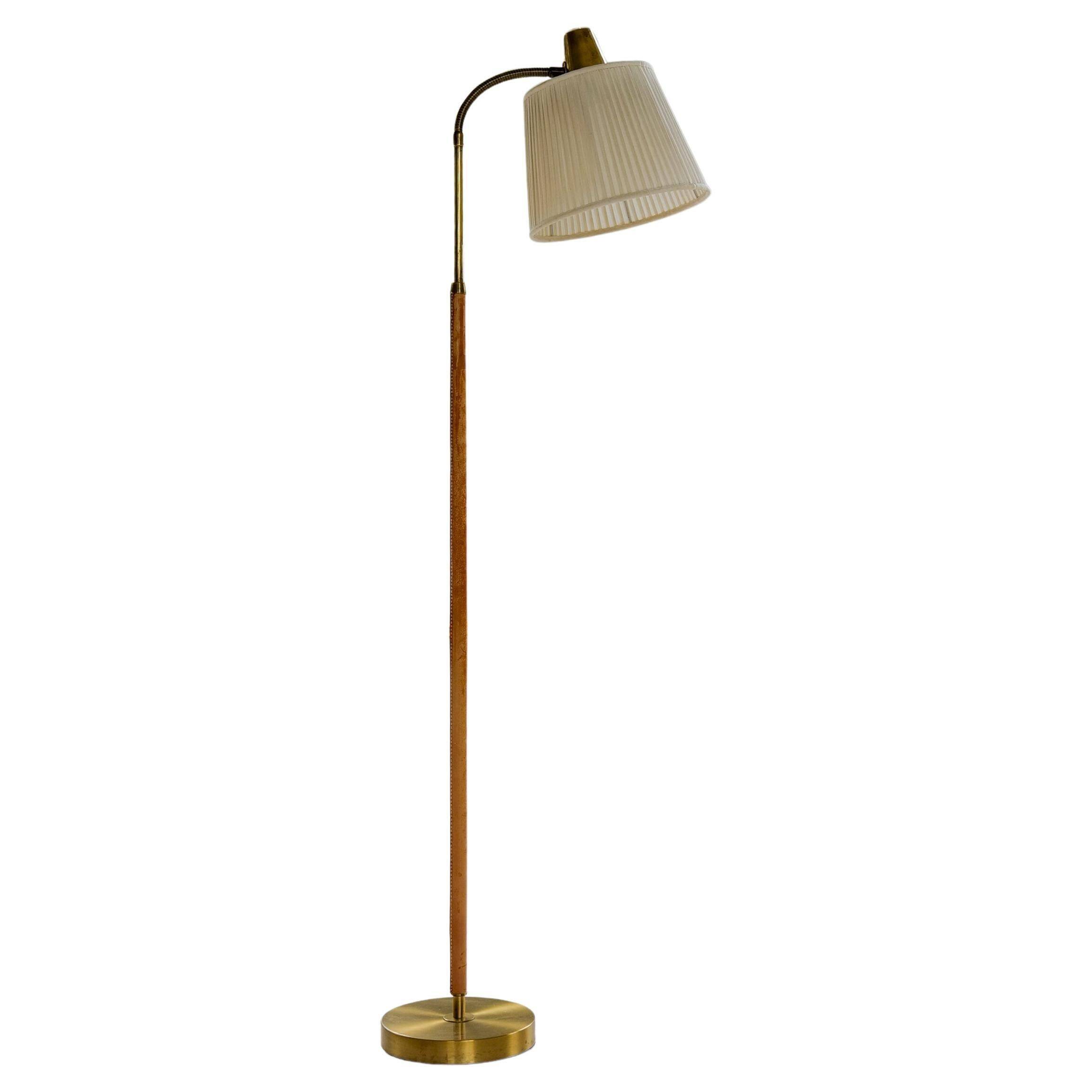 Mid-century brown leather and brass floor lamp, Falkenbergs Belysning, Sweden, 1960s.