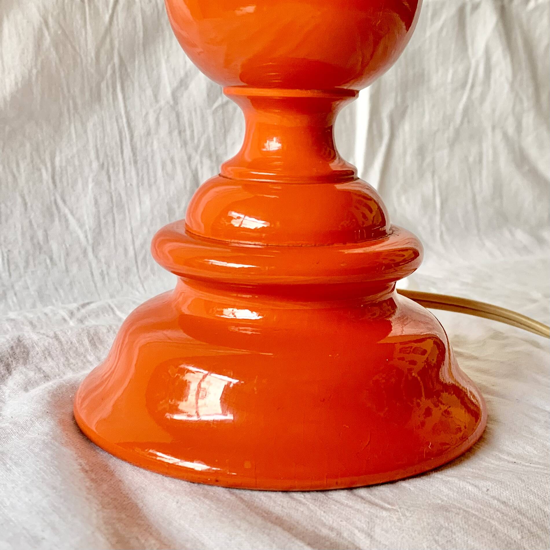 Large vintage lamp base in orange lacquered wood