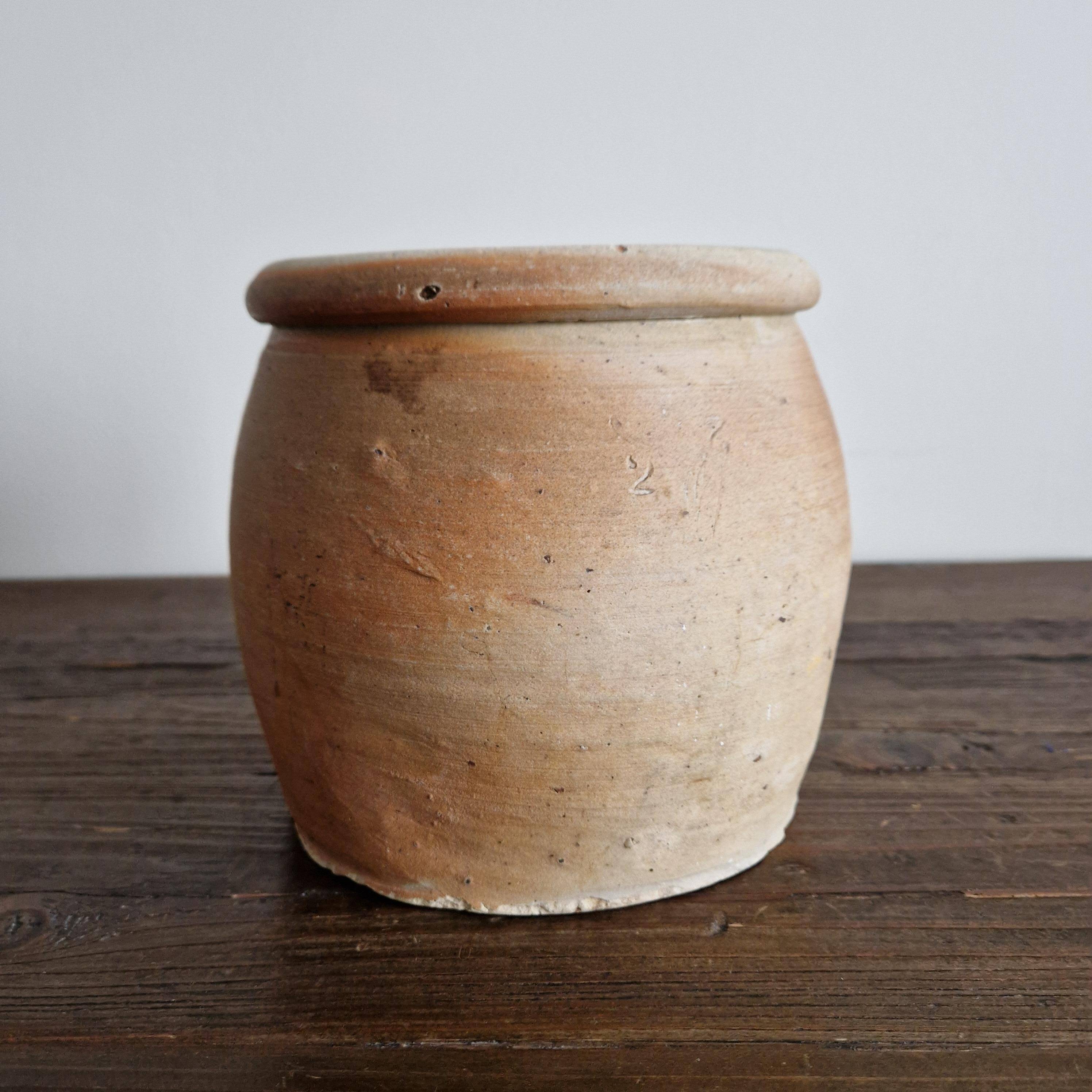 Ancient terracotta pot with a handle