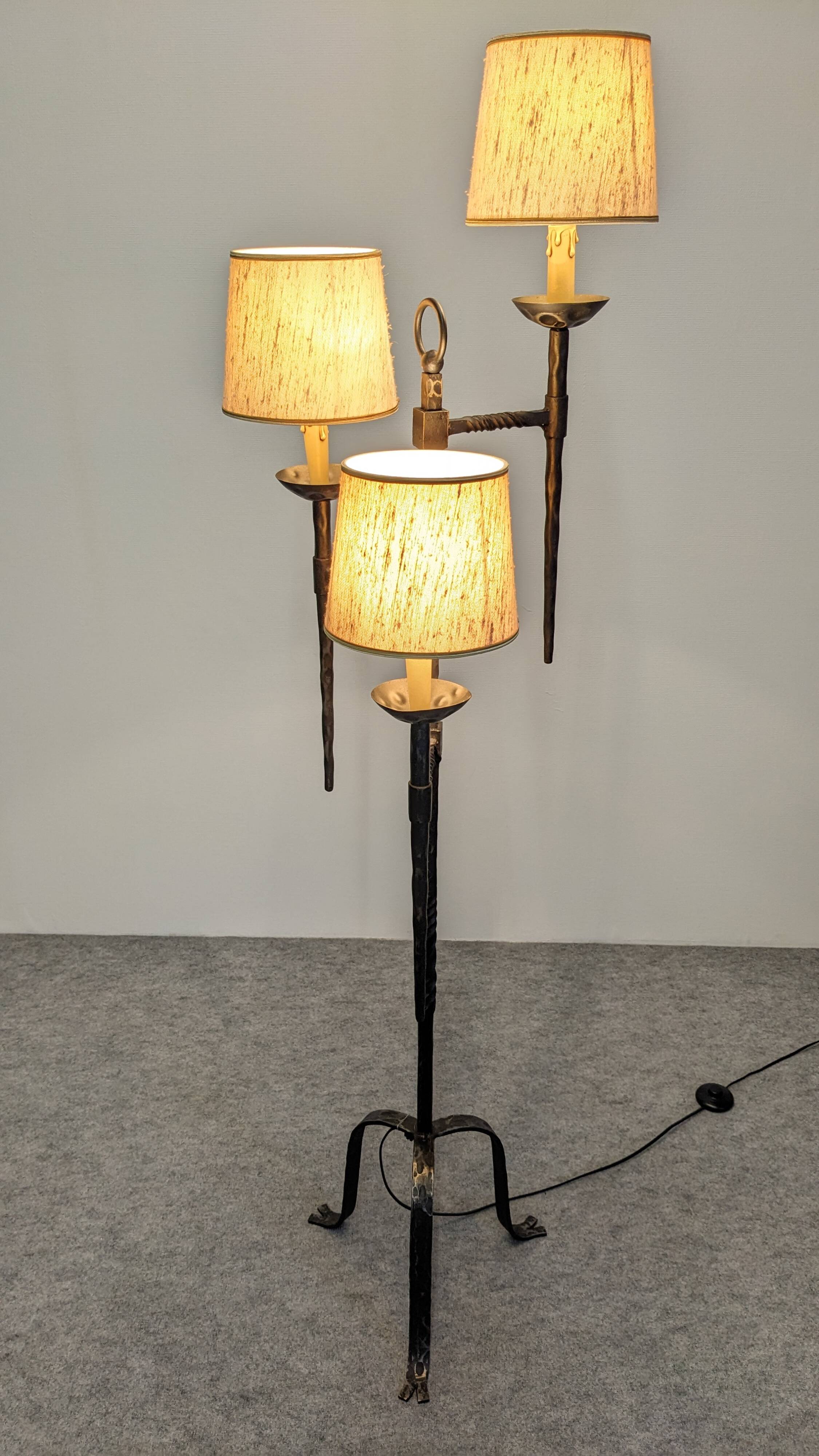 Brutalist tripod floor lamp with 3 lights in wrought iron, France circa 1950.