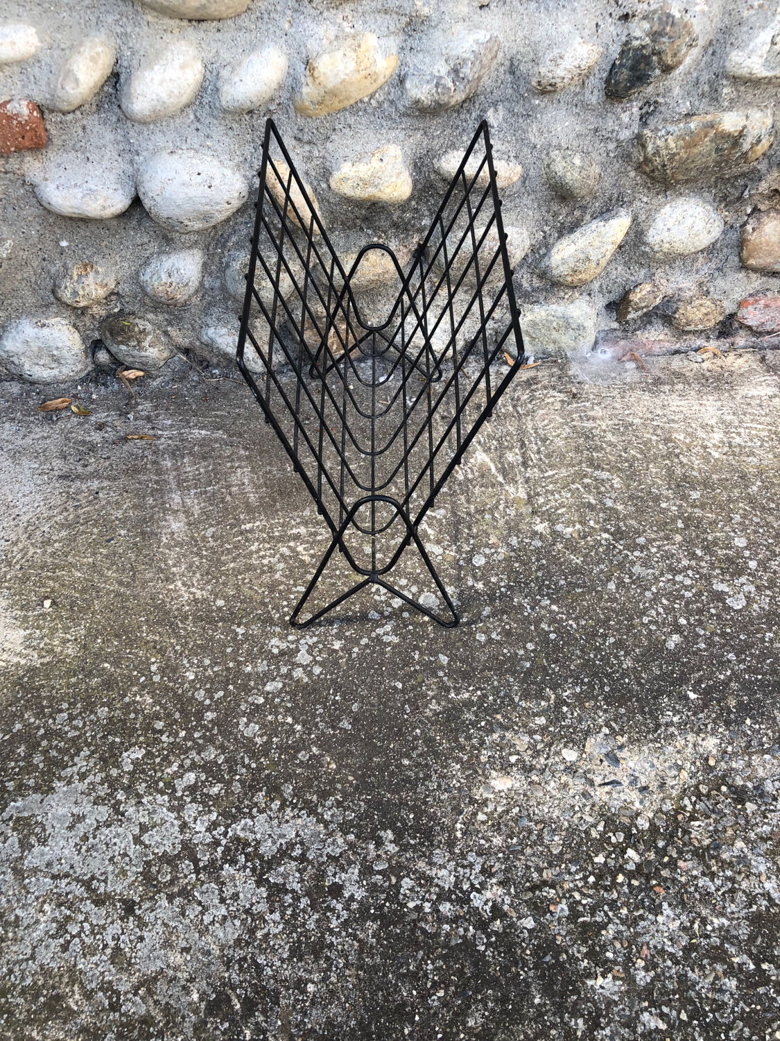 Black metal magazine rack