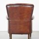 Sheep leather armchair correctly finished with decorative nails