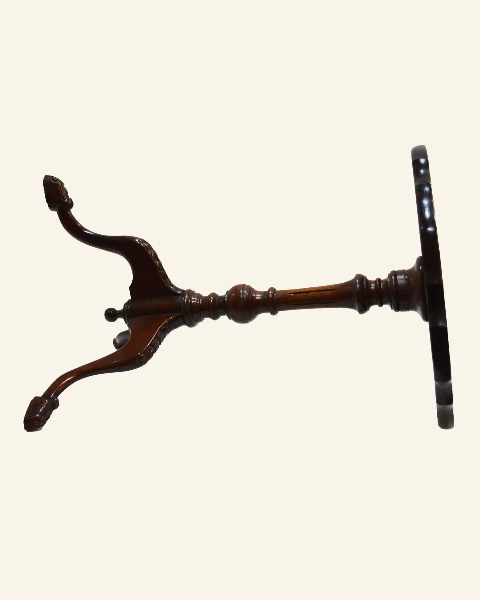 African mahogany guéridon, turned with a sculpted tripod leg.