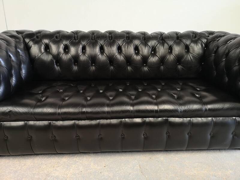 Black leather chesterfield sofa