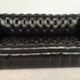 Black leather chesterfield sofa