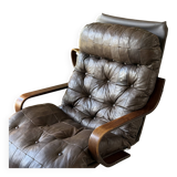 1970s Scandinavian armchair in curved laminated wood with a leather seat.