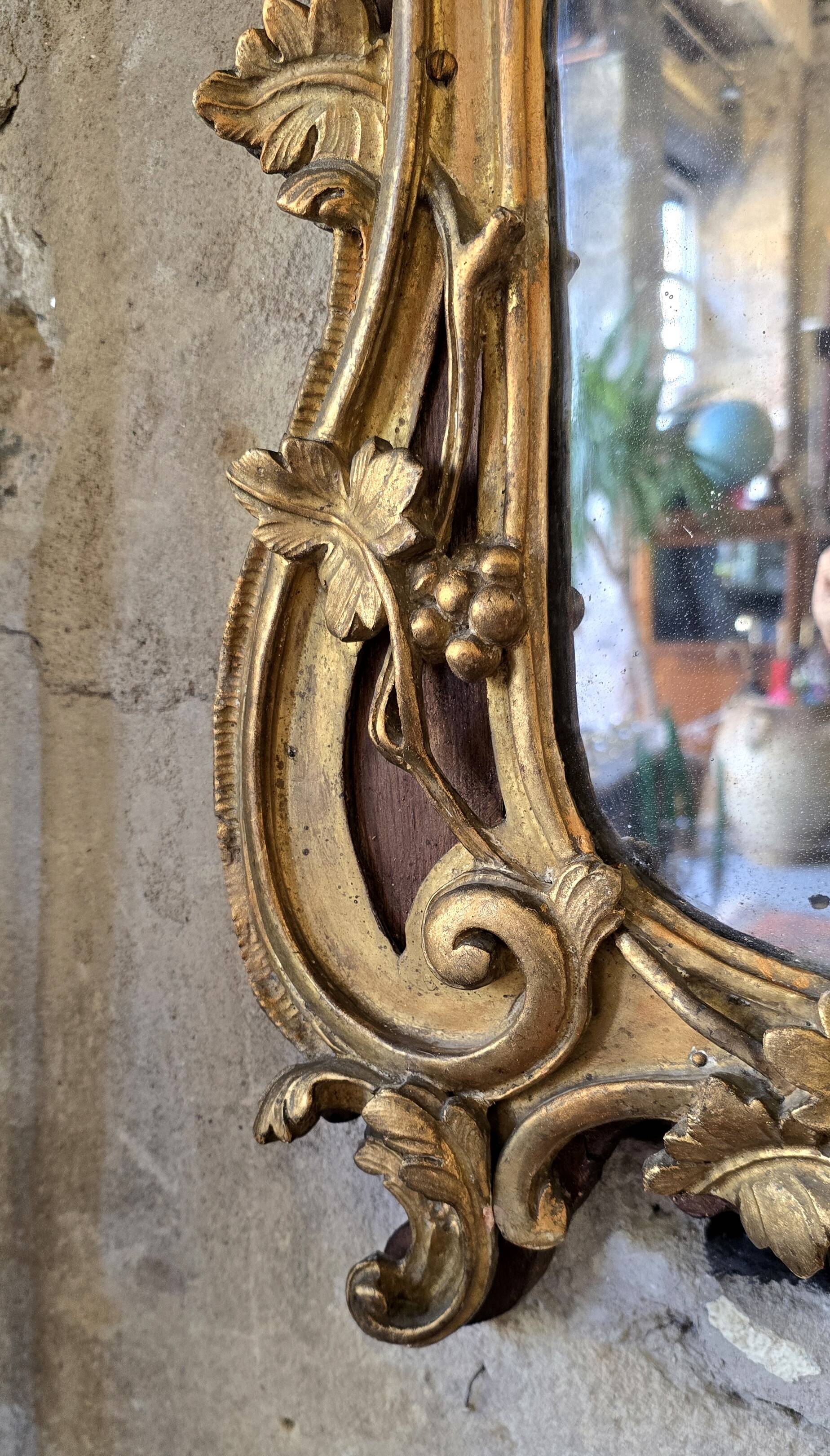 Louis XV period mirror in gilded wood and stucco, 18th century