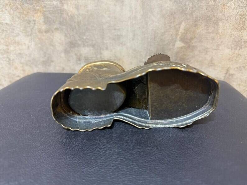 Vintage ashtray in the shape of a hiking boot with a hinged lid
