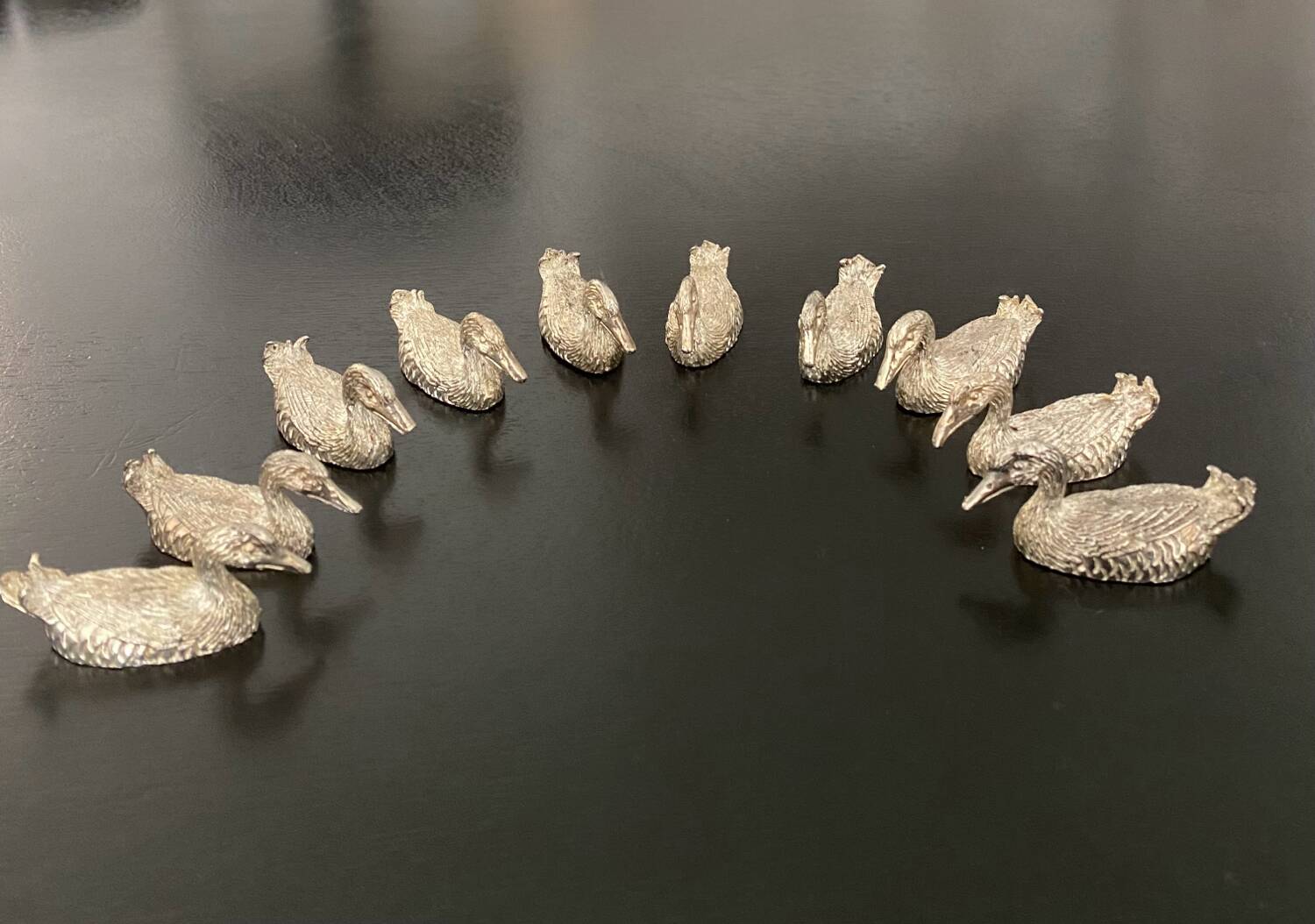10 duck-shaped knife holders in silver-colored metal