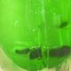 Green blown glass bottle of 58 cm.
