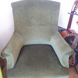 Old green velvet armchair