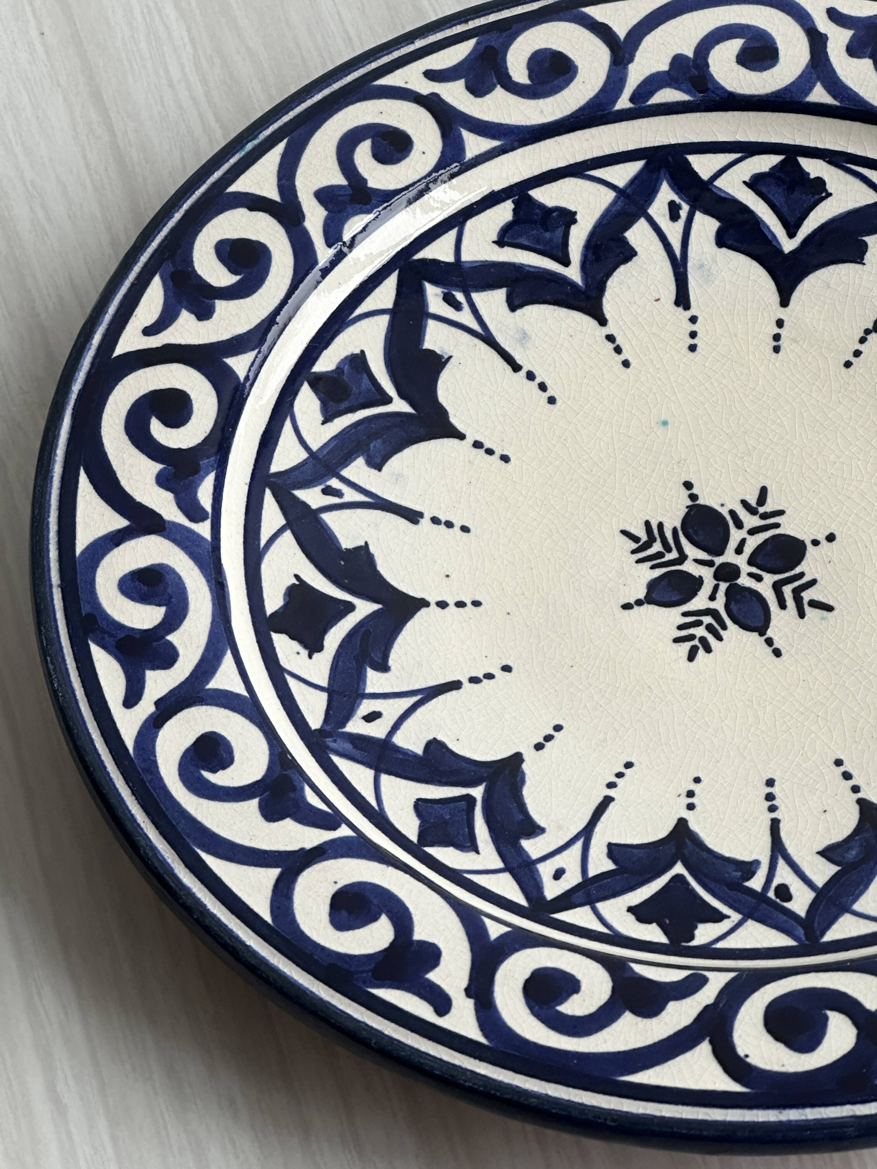 Raised dish, ceramic plate with blue and white patterns.