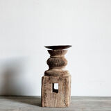 Candle holder in light carved wood