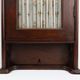 Armoire haute Art Déco française avec porte vitrée et compartiment caché, vers 1910