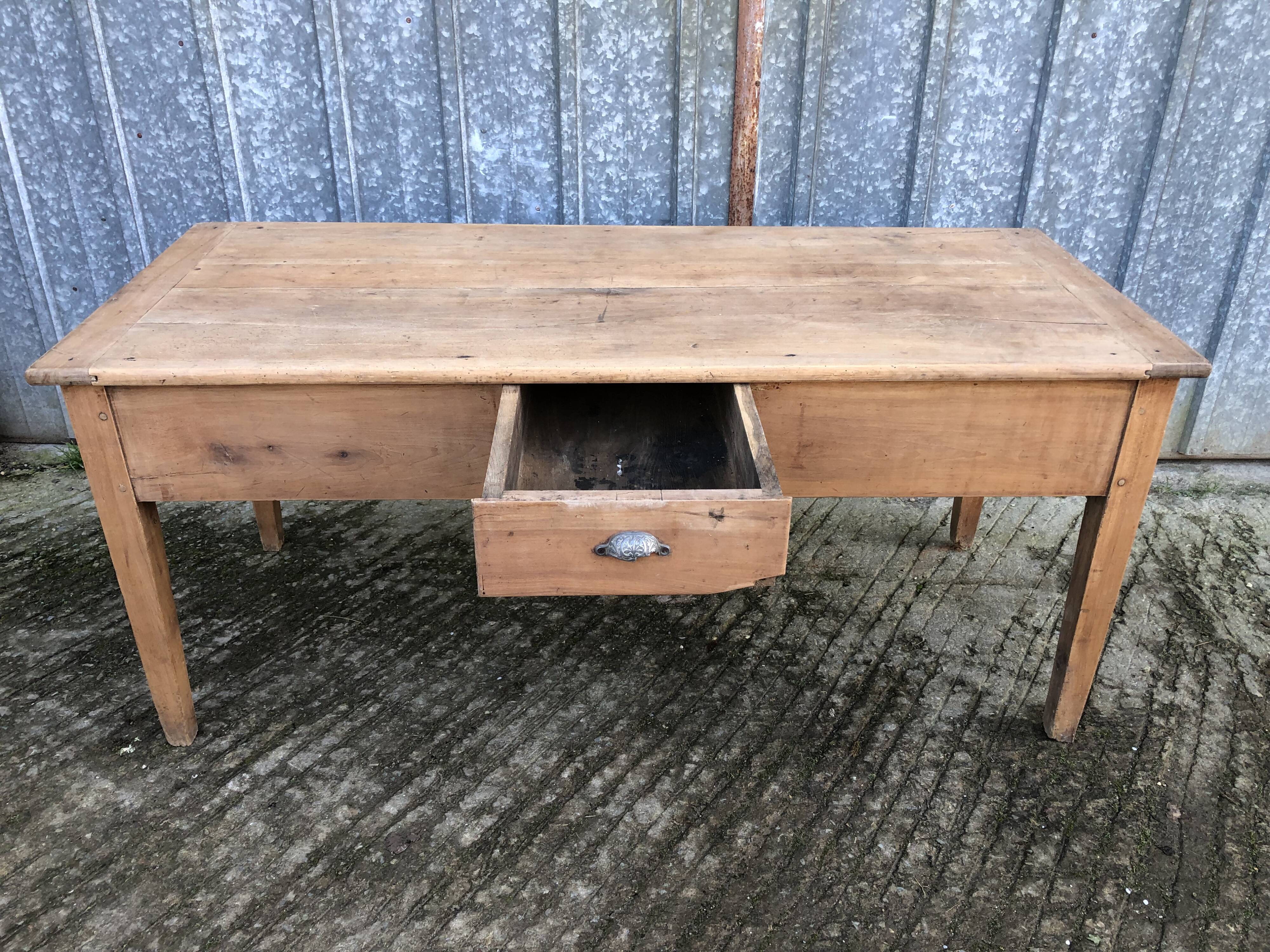 Antique solid cherry farmhouse table with 3 drawers and 1 pull out.