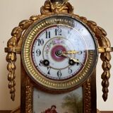 Napoleon III clock in gilded bronze and porcelain plates decorated and painted by hand