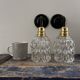 Pair of chiseled glass wall sconces