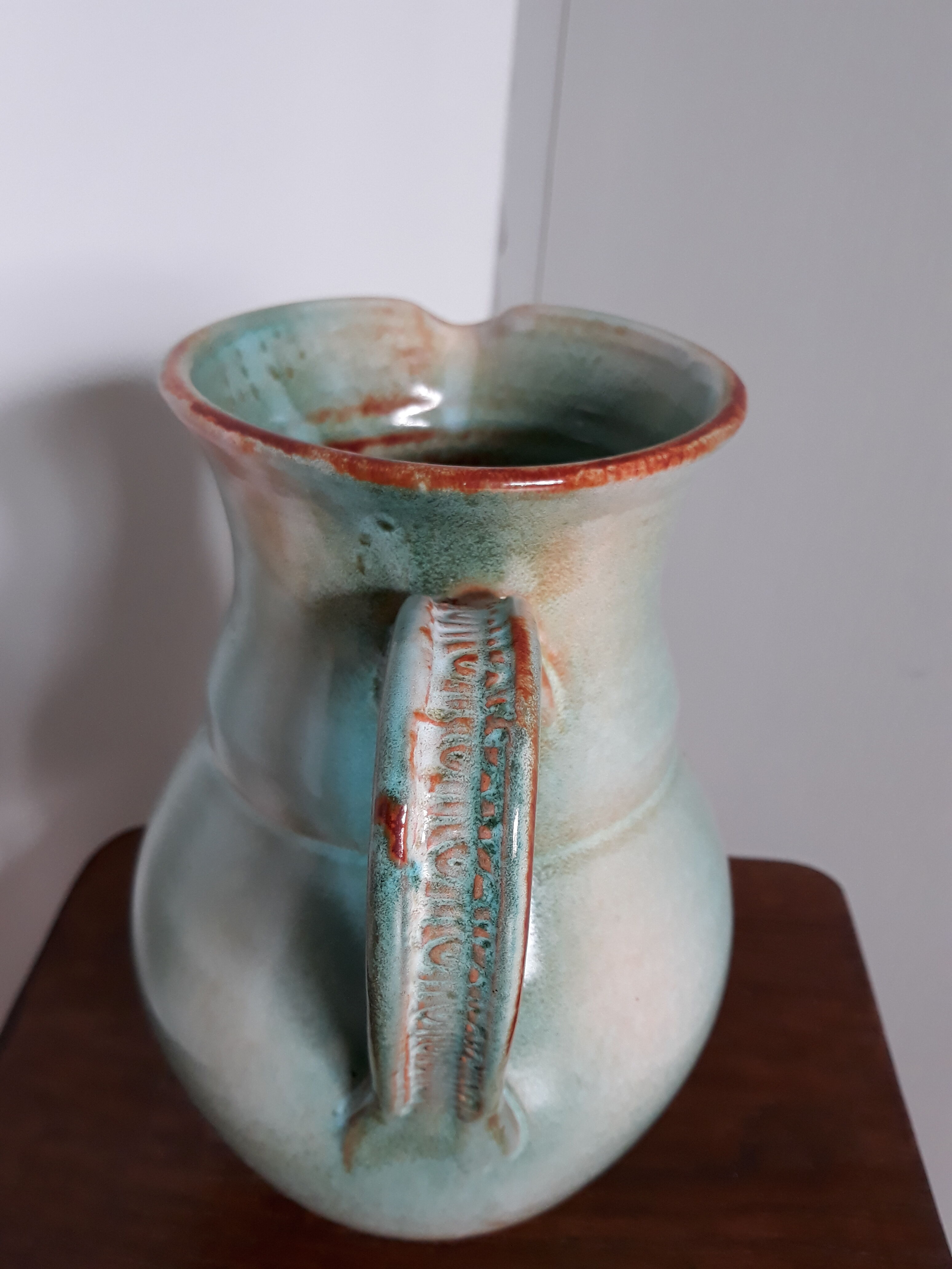 Pitcher with handle green celadon turquoise and caramel