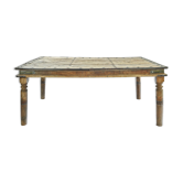 Carved and studded wooden table