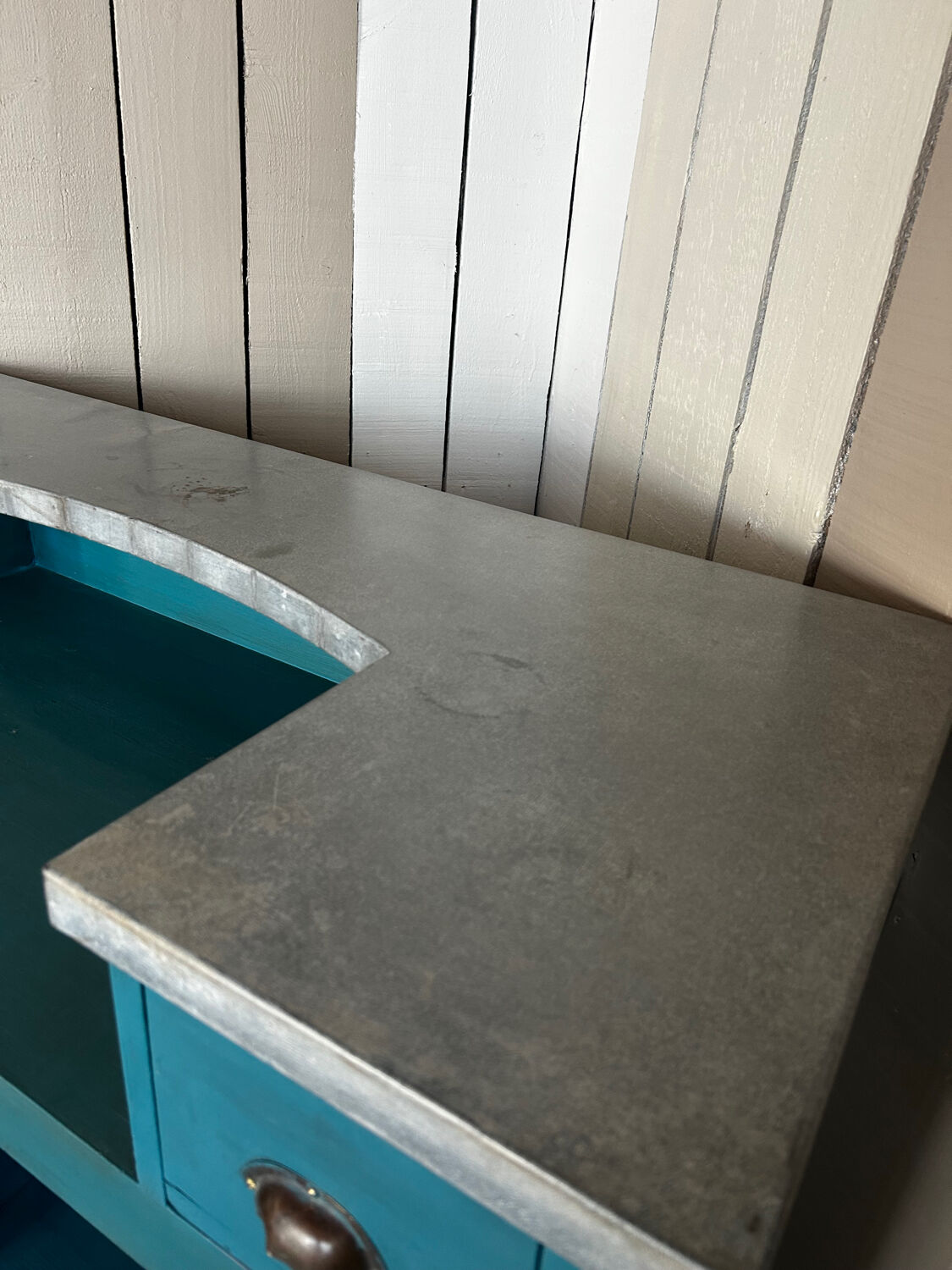 Old wooden trade counter with a zinc top.