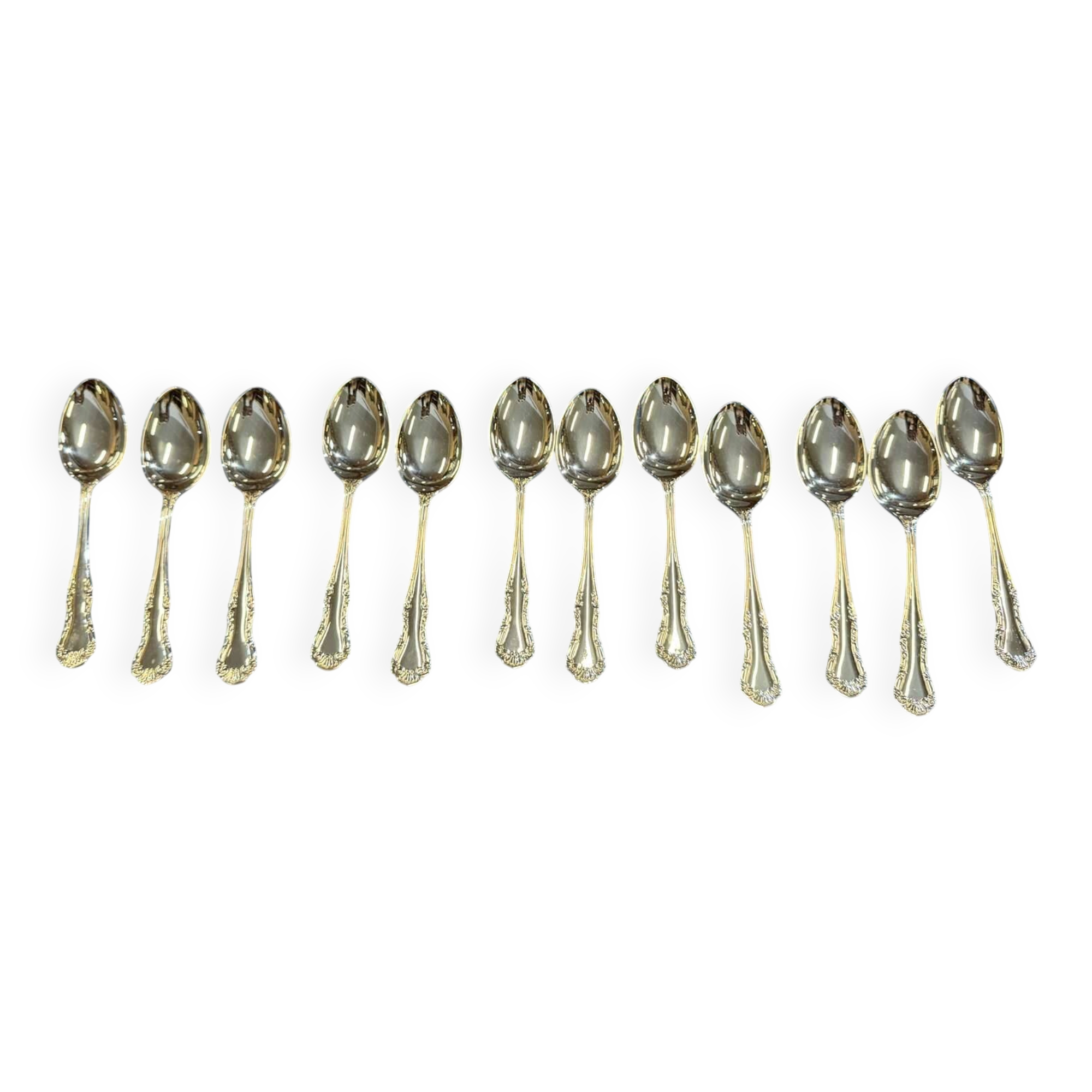 Set of 12 dessert spoons by Mappin and Webb in silver plate.