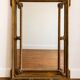 Large Napoleon III mirror 130 × 93 cm — gilded frame sculpted with ribbon pediment.