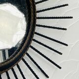 Vintage black and gold metal sun mirror from the 1960s.