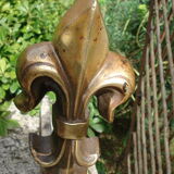 Pair of old chenets fleur de lys pattern