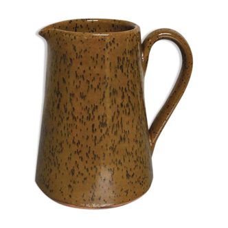 Milk pitcher in spotted sandstone