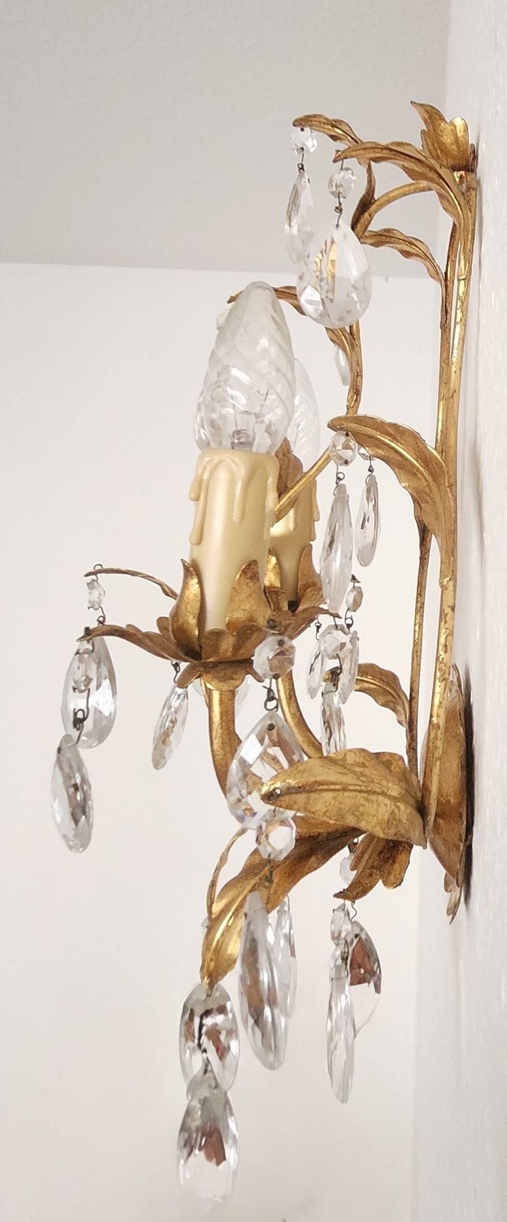 Hand-forged wall lamp gilded with gold leaf and crystals, Italy