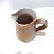 Vintage creamer in marsh sandstone
