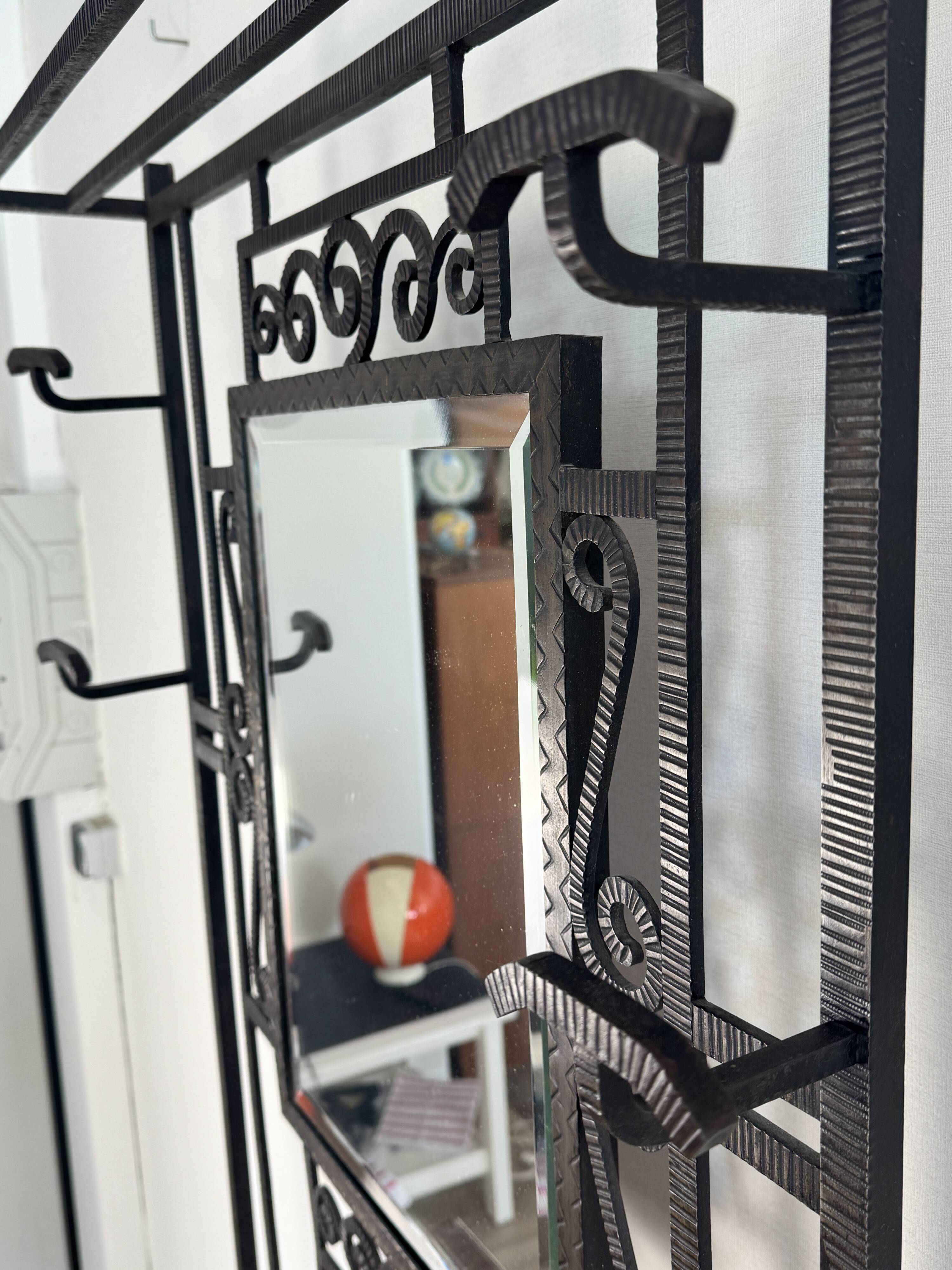 Entrance hall with hammered wrought iron in Art Deco style, in the manner of Edgar Brandt.