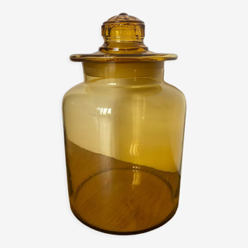 Old apothecary jar in blown amber glass