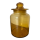Old apothecary jar in blown amber glass