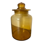 Old apothecary jar in blown amber glass