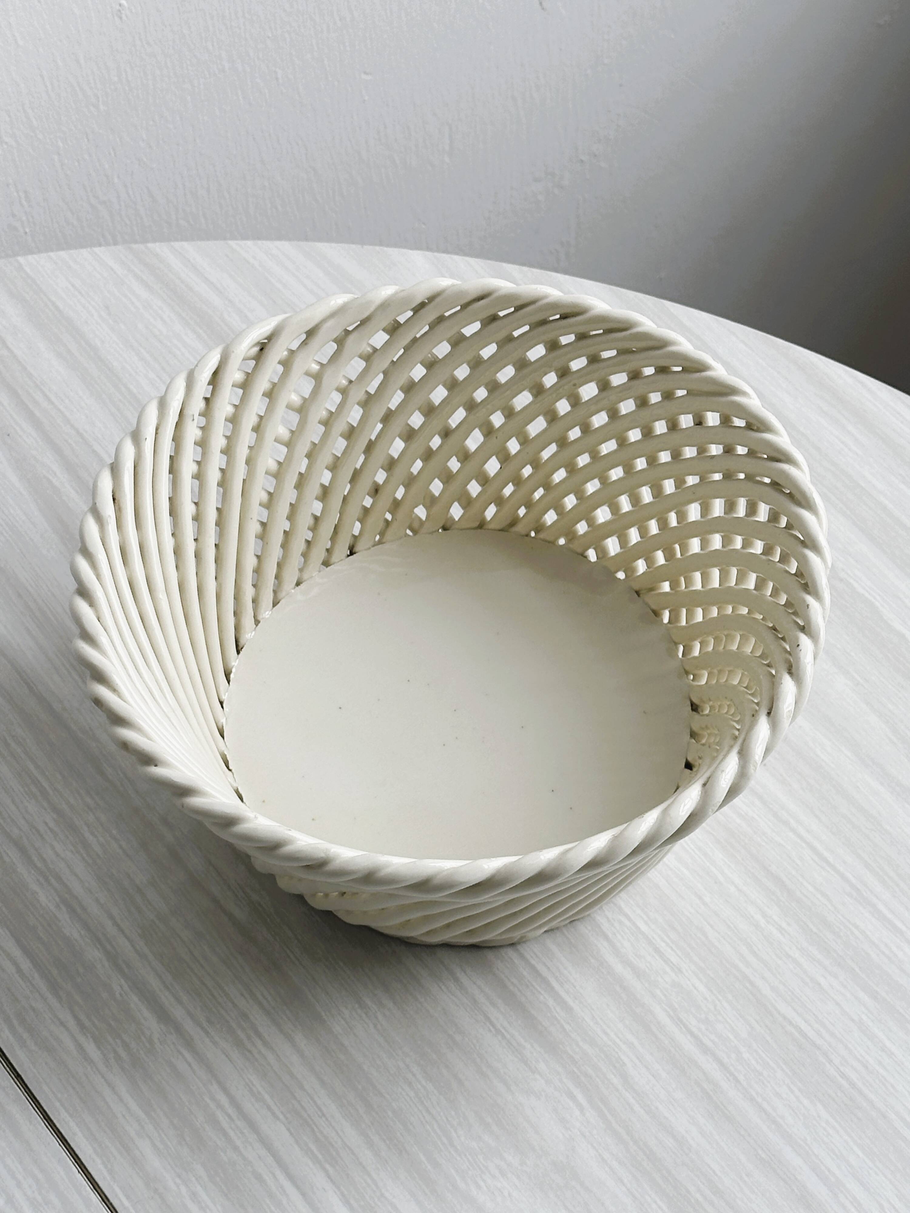 Bread basket - openwork white ceramic bowl.