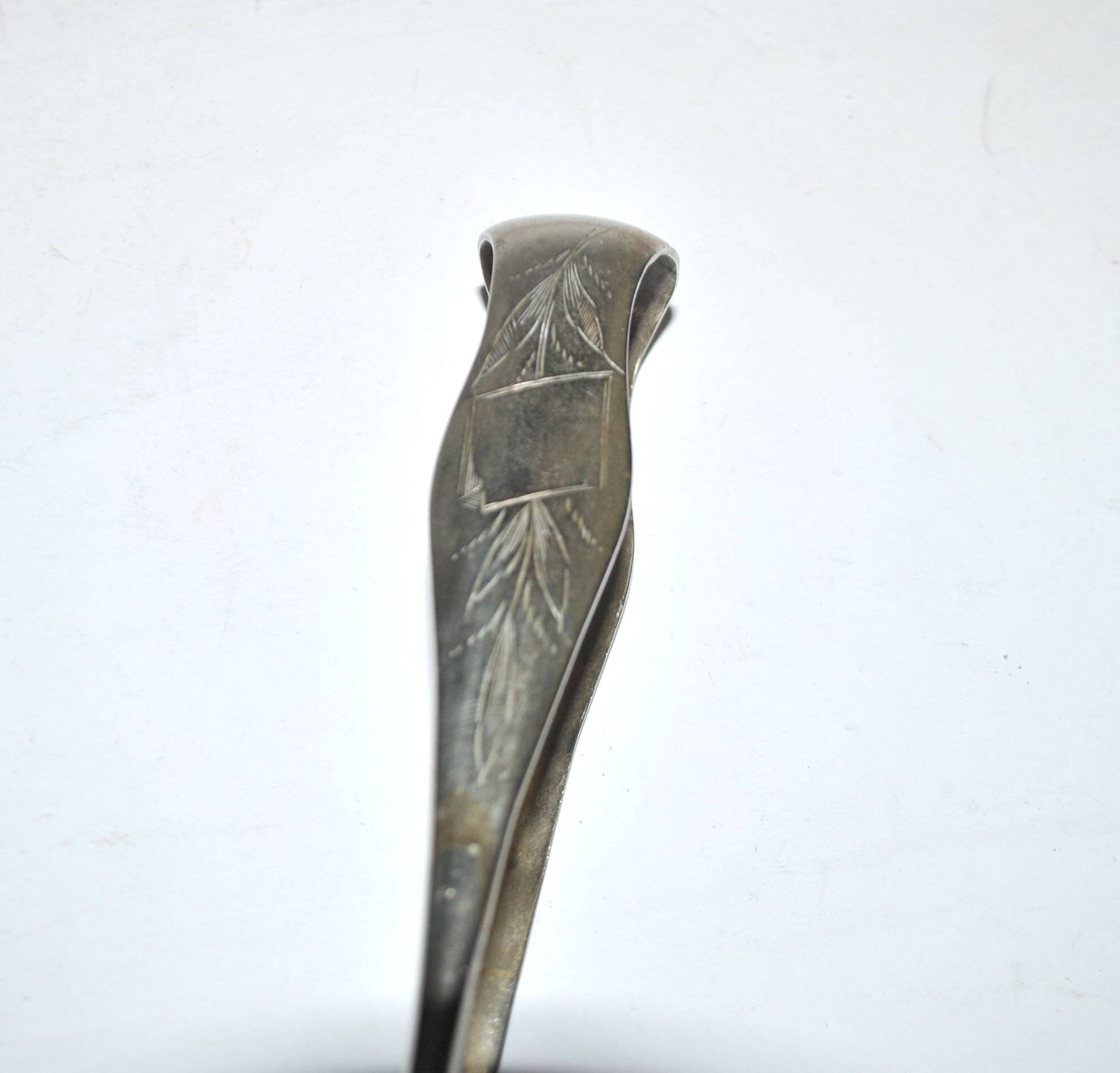 Vintage engraved silver metal lion claw sugar tongs