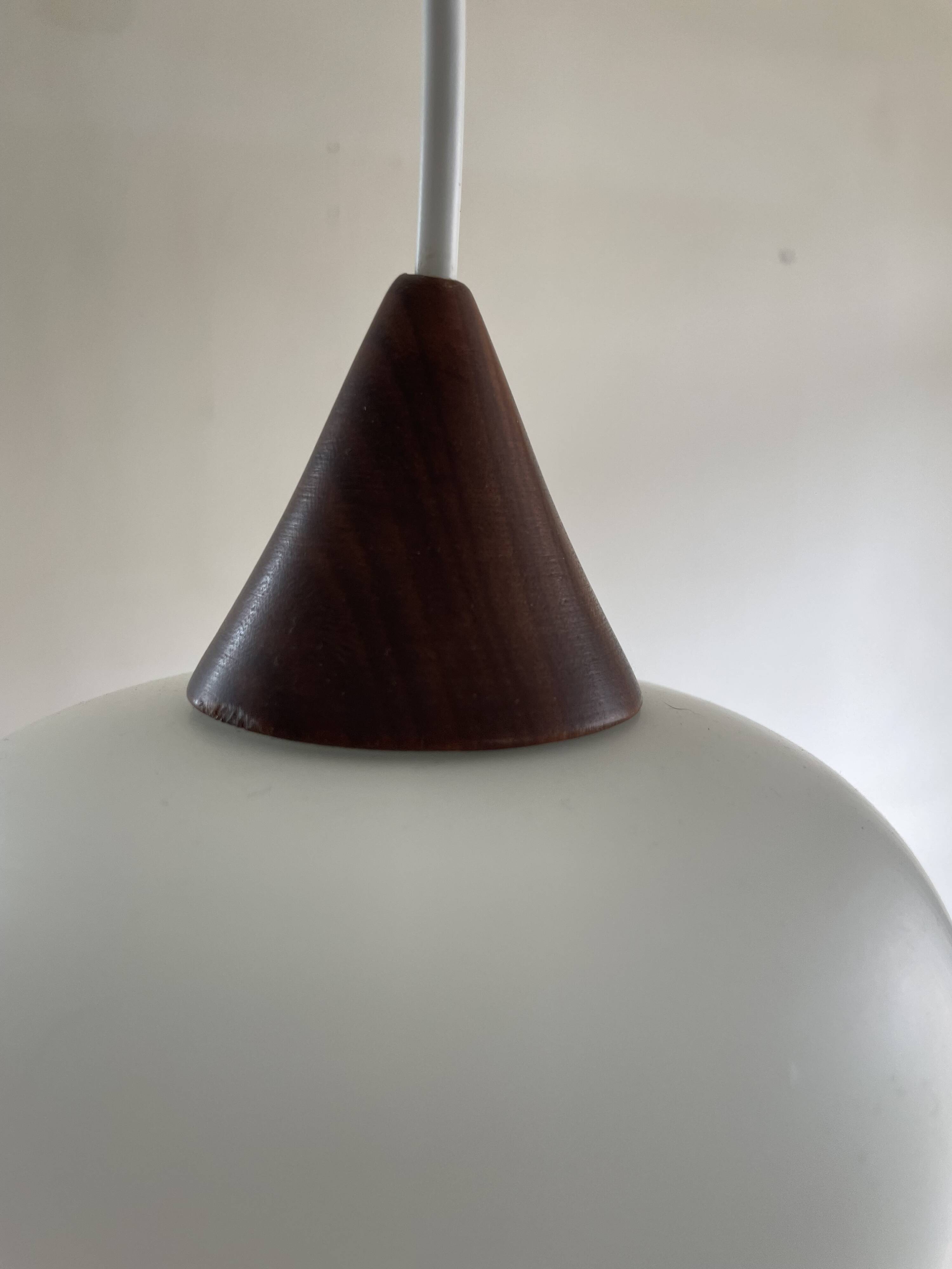Danish teak and milk glass pendant lamp.