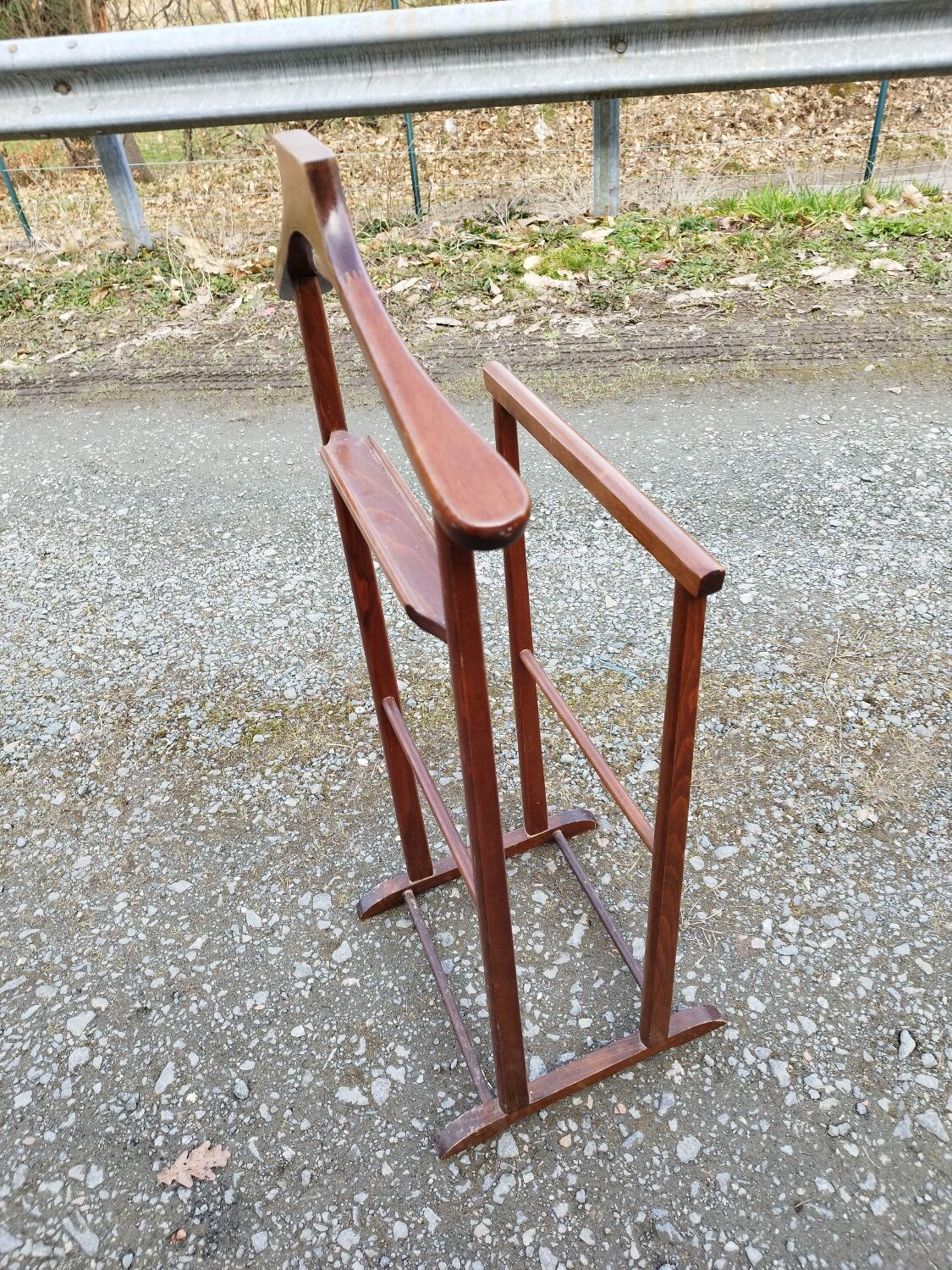 Valet wearing double wood coat rack