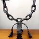 Pair of wrought iron chain candlesticks, Spain