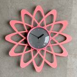 Pink Karlsson wall clock in a mid century shape