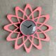 Pink Karlsson wall clock in a mid century shape